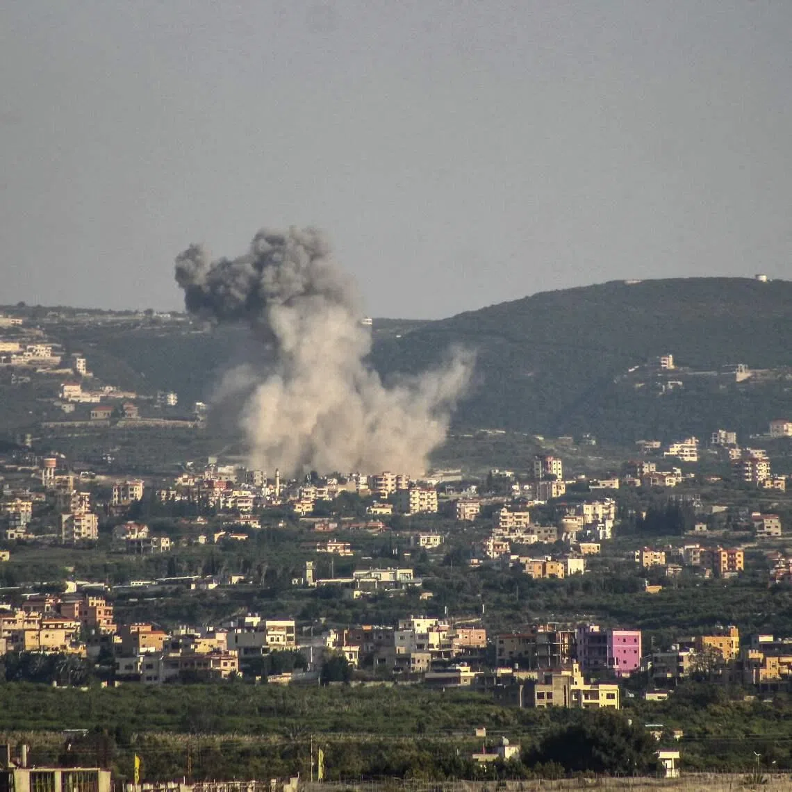 Smoke rises from the site of Israeli airstrikes that targeted villages on southern Lebanon on April 16.