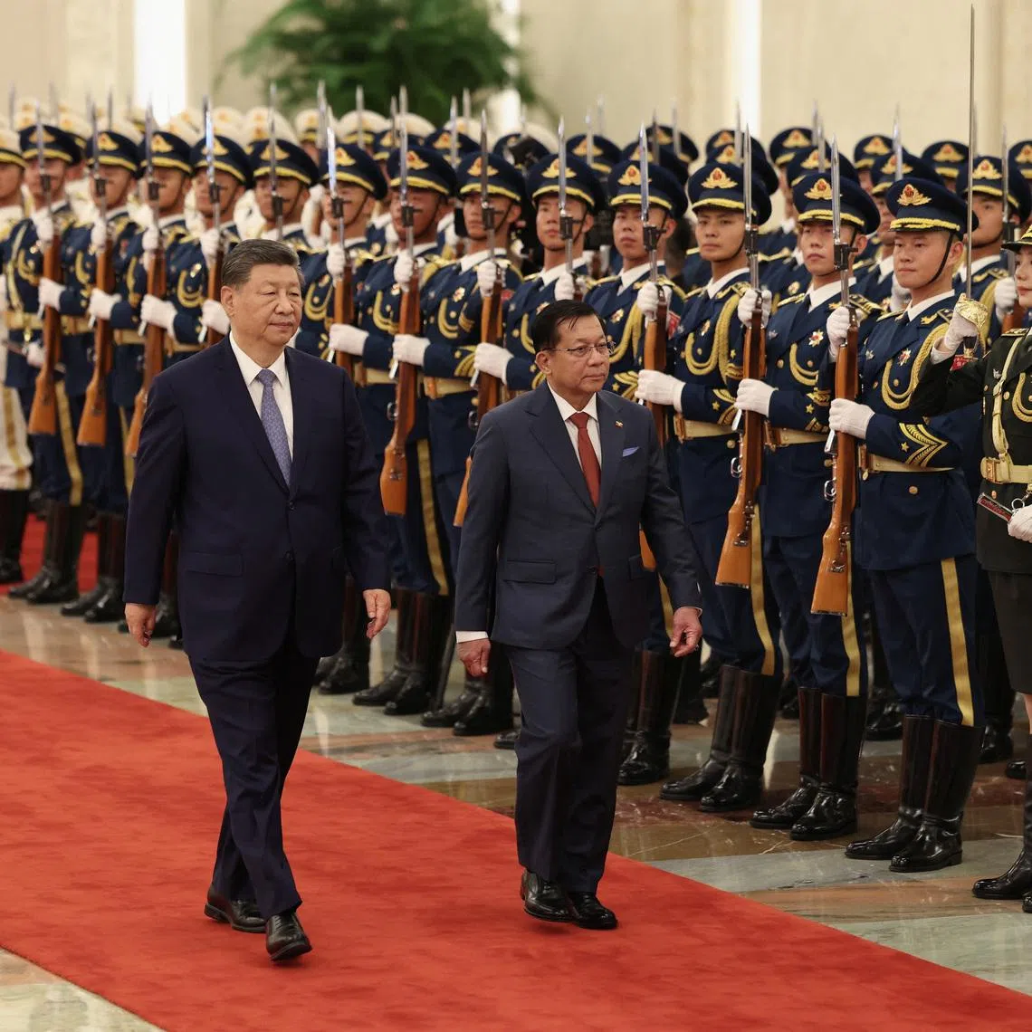Chinese President Xi Jinping (left) and Myanmar's President Min Aung Hlaing attend a welcoming ceremony at the Great Hall of the People on June 16 in Beijing, China.