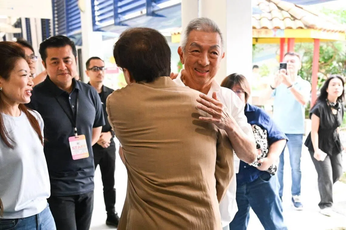 Jackie Chan with Singaporean businessman and philanthropist Peter Lim at Pei Chun Public School in Toa Payoh on July 7.