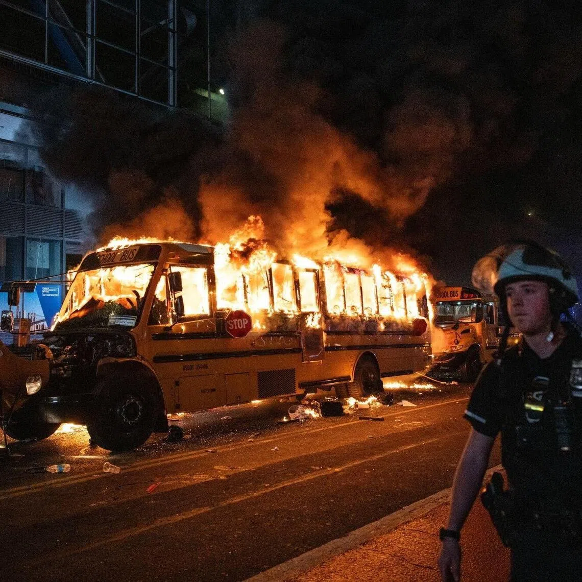A school bus burning as fans celebrate after the New York Knicks defeated the San Antonio Spurs in Game 5 of the NBA Finals to win the title in New York early on June 14, 2026.