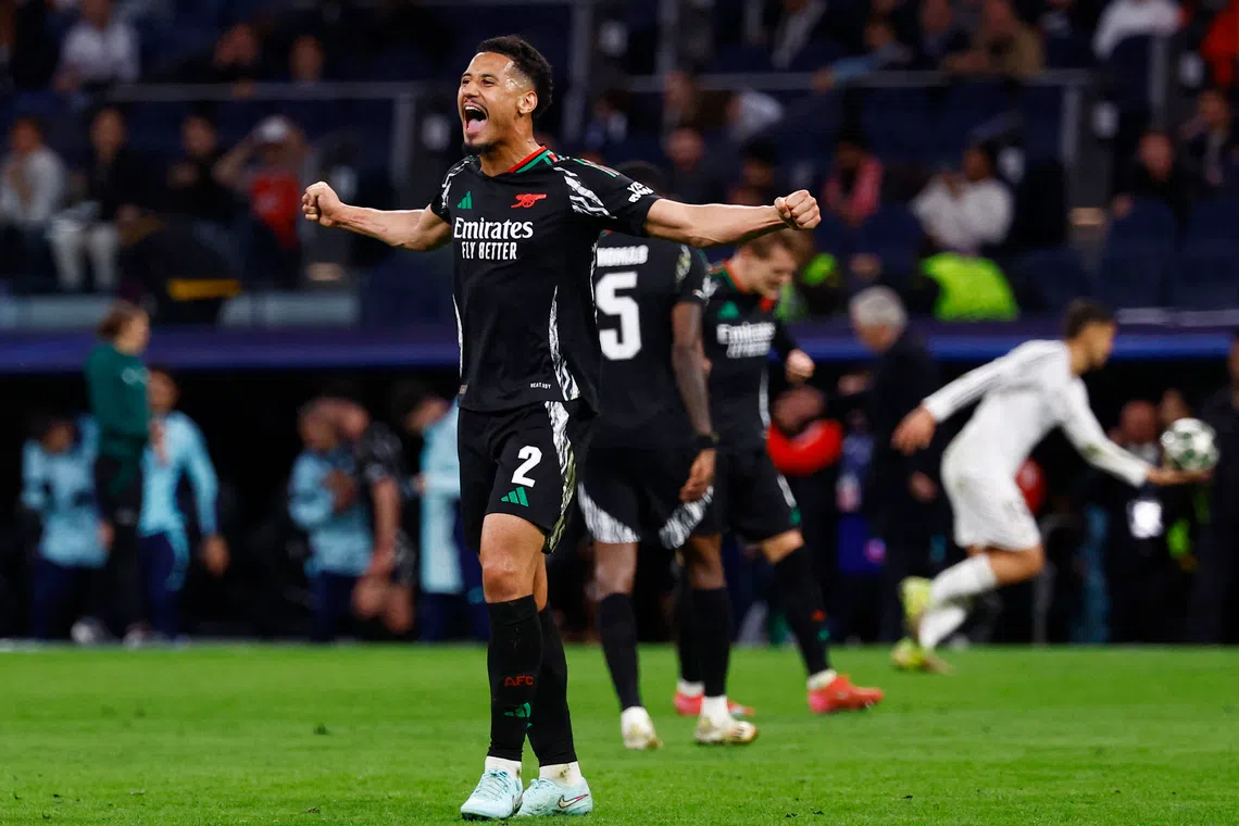Soccer Football - Champions League - Quarter Final - Second Leg - Real Madrid v Arsenal - Santiago Bernabeu, Madrid, Spain - April 16, 2025 Arsenal's William Saliba celebrates after the match REUTERS/Susana Vera