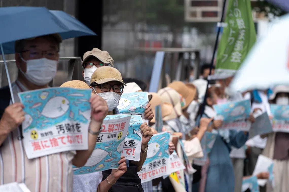 Protesters during a rally against the release of treated radioactive water, outside the Tepco headquarters in Tokyo, on Aug 24.