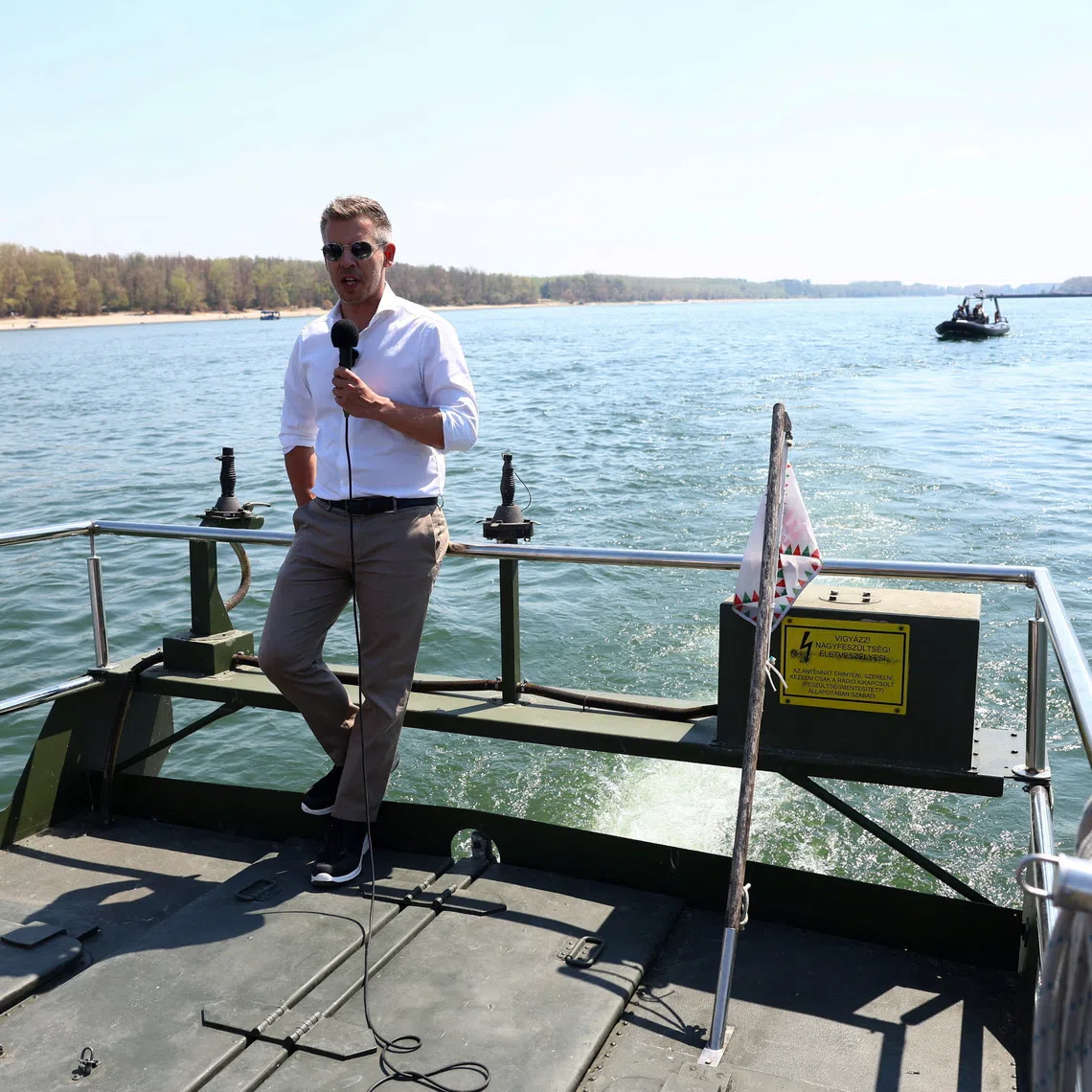 FILE PHOTO: Hungarian Prime Minister Peter Magyar talks to the media as he visits the construction site, where work is underway to raise the Danube's water level in Paks, Hungary, August 15, 2026. REUTERS/Bernadett Szabo/FIle Photo
