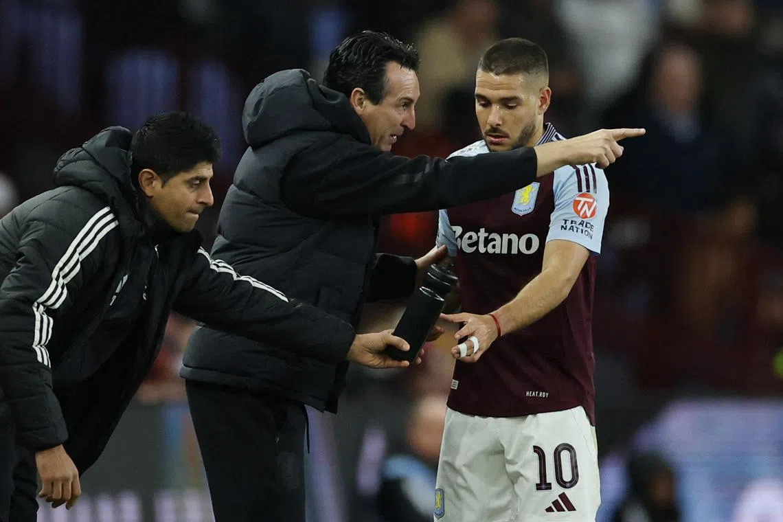 Aston Villa's Emiliano Buendia receives instructions from manager Unai Emery during their League Cup clash against Crystal Palace.