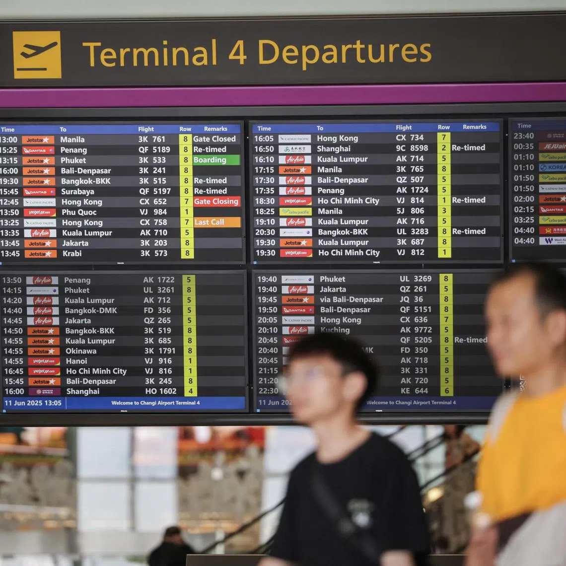 Ground staff assisting passengers with check-in at the airline?s counter in Changi Airport Terminal 4 on June 11, 2025.
