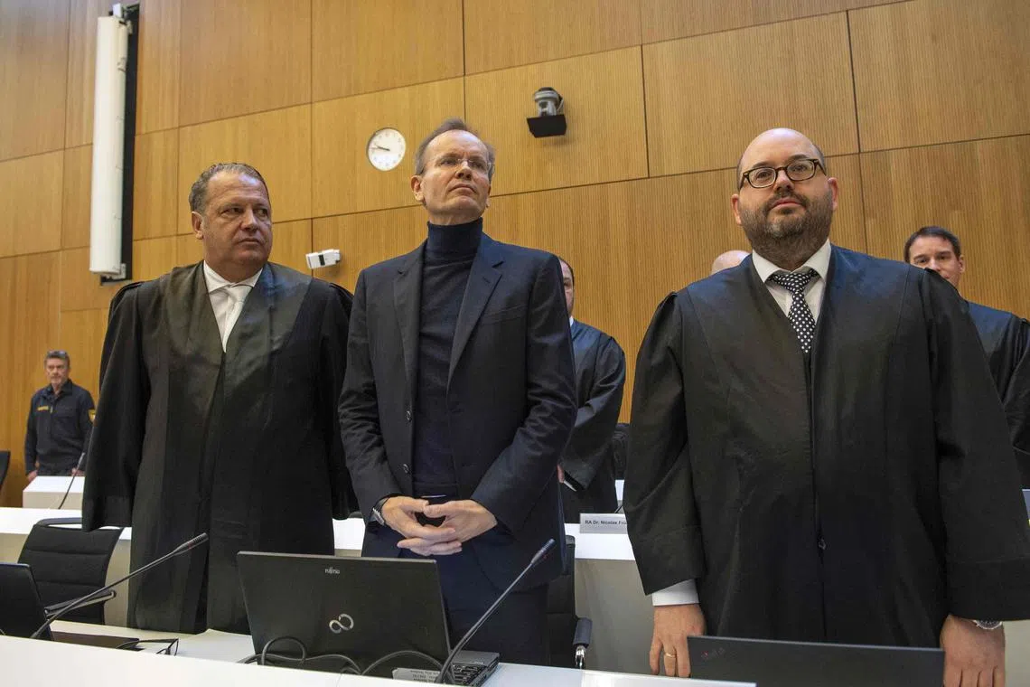 Former Wirecard CEO Markus Braun (C) stands next to his lawyers Alfred Dierlamm (L) and Nico Werning (R) in the courtroom at the District Court in Munich, southern Germany, on Dec 8, 2022. 