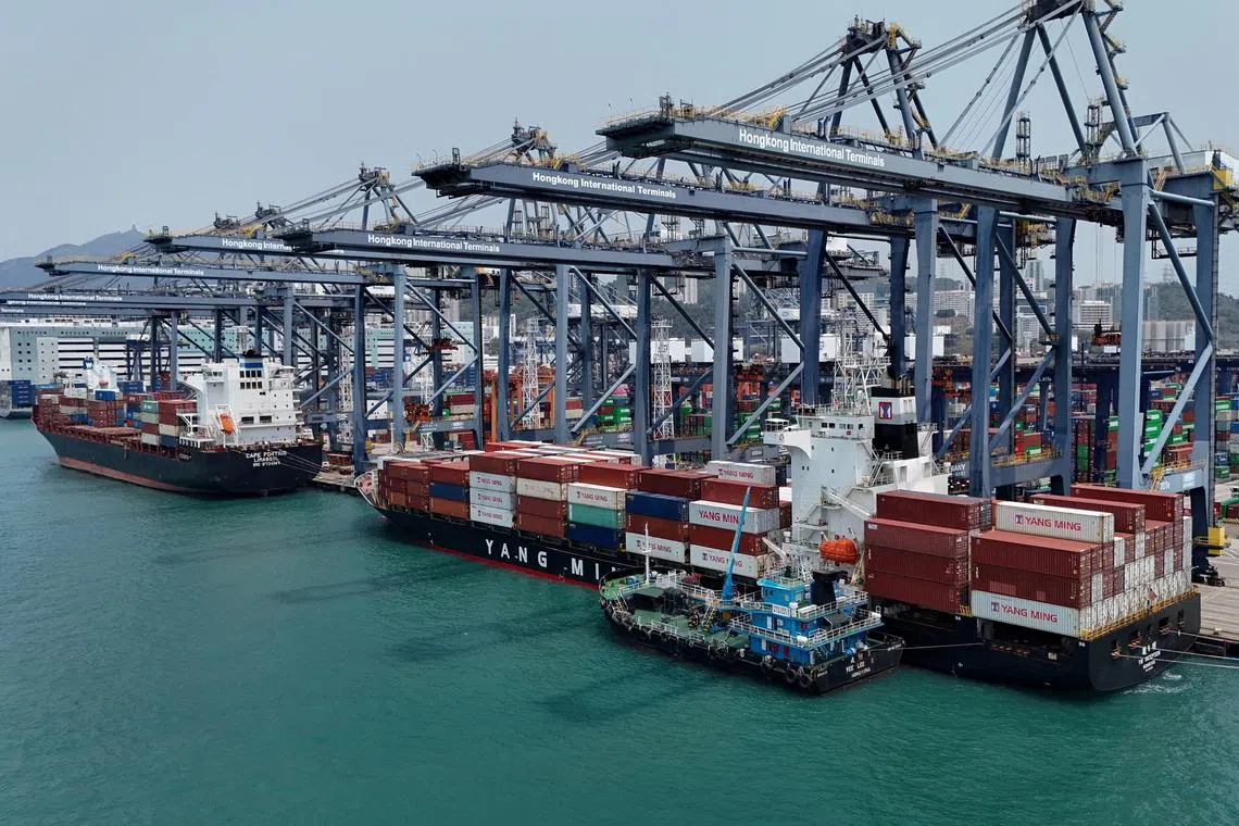 FILE PHOTO: A drone view shows containers at the terminals at the port in Kwai Chung in Hong Kong, China, April 3, 2025. REUTERS/Tyrone Siu/File Photo