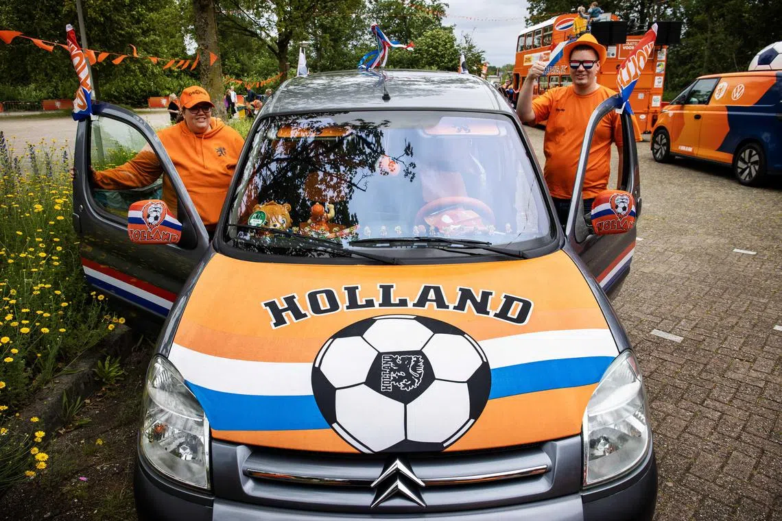 Sjoukje and Jellert from Emmen during a fan parade at football club HHC Hardenberg, Netherlands on June 14, 2024. The KNVB organised a fan parade with the hope that as many Oranje fans as possible will set sail in a caravan to Hamburg, where the Dutch will play their first Euro 2024 match against Poland.