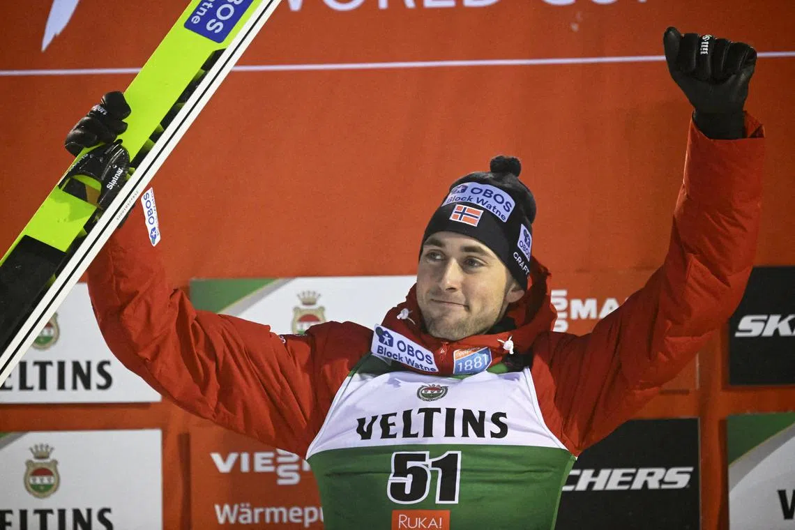 FILE PHOTO: Ski Jumping - FIS Ski Jumping World Cup - Ruka, Finland - December 1, 2024 Second placed Norway's Jarl Magnus Riiber celebrates on the podium after the Men's Individual Mass Start Large Hill HS142  MARKKU ULANDER/Lehtikuva via REUTERS/File Photo