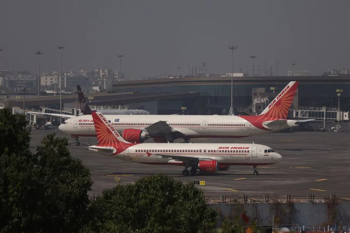 Air India passenger aircraft are seen on the tarmac at Chhatrapati Shivaji International airport in Mumbai, India, February 14, 2023. REUTERS/Francis Mascarenhas/File photo