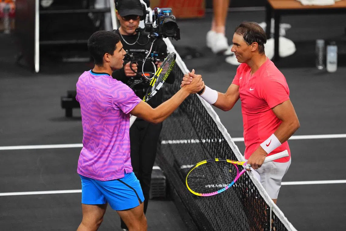 Carlos Alcaraz and Rafael Nadal at the Netflix Slam at Michelob ULTRA Arena.