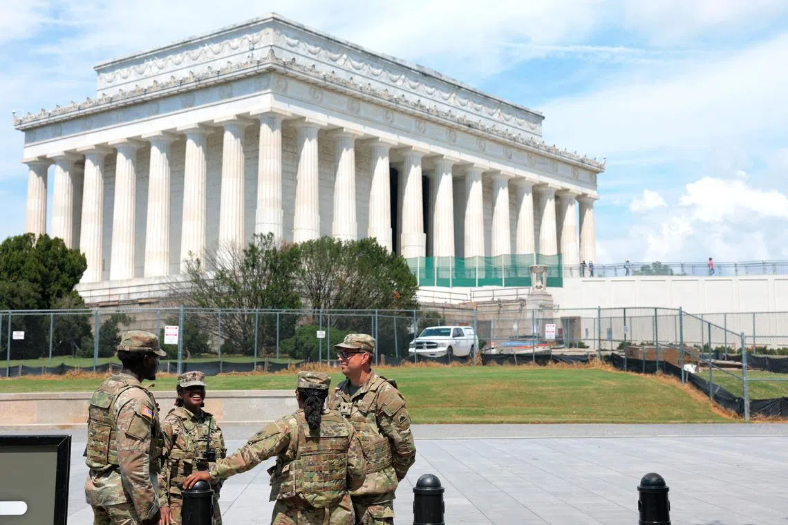 National Guard troops stand by at the Lincoln Memorial in Washington, DC, on Aug 14.