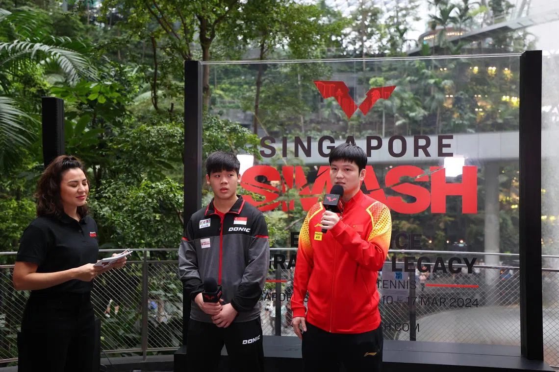 China’s Fan Zhendong (right) and Singapore’s Izaac Quek at the World Table Tennis Singapore Smash draw ceremony at Jewel. 