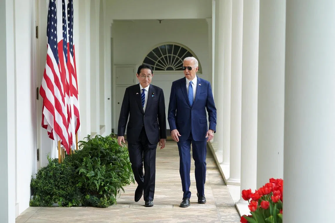 US President Joe Biden and Japanese Prime Minister Fumio Kishida walk along the White House Colonnade on April 10.