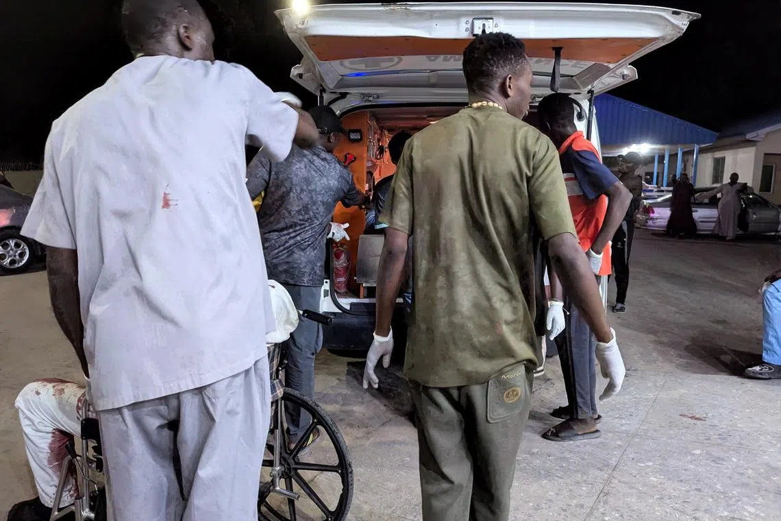 Members of the Nigerian Red Cross assist wounded victims into an ambulance after multiple explosions struck the northeastern city of Maiduguri, Borno State, Nigeria, March 16, 2026. REUTERS/Adewale Kolawole