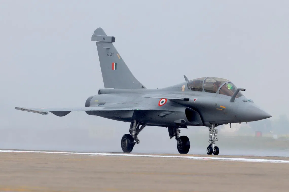 FILE PHOTO: Rafale fighter jet taxis on the tarmac during its induction ceremony at an air force station in Ambala, India, September 10, 2020. REUTERS/Adnan Abidi/File Photo