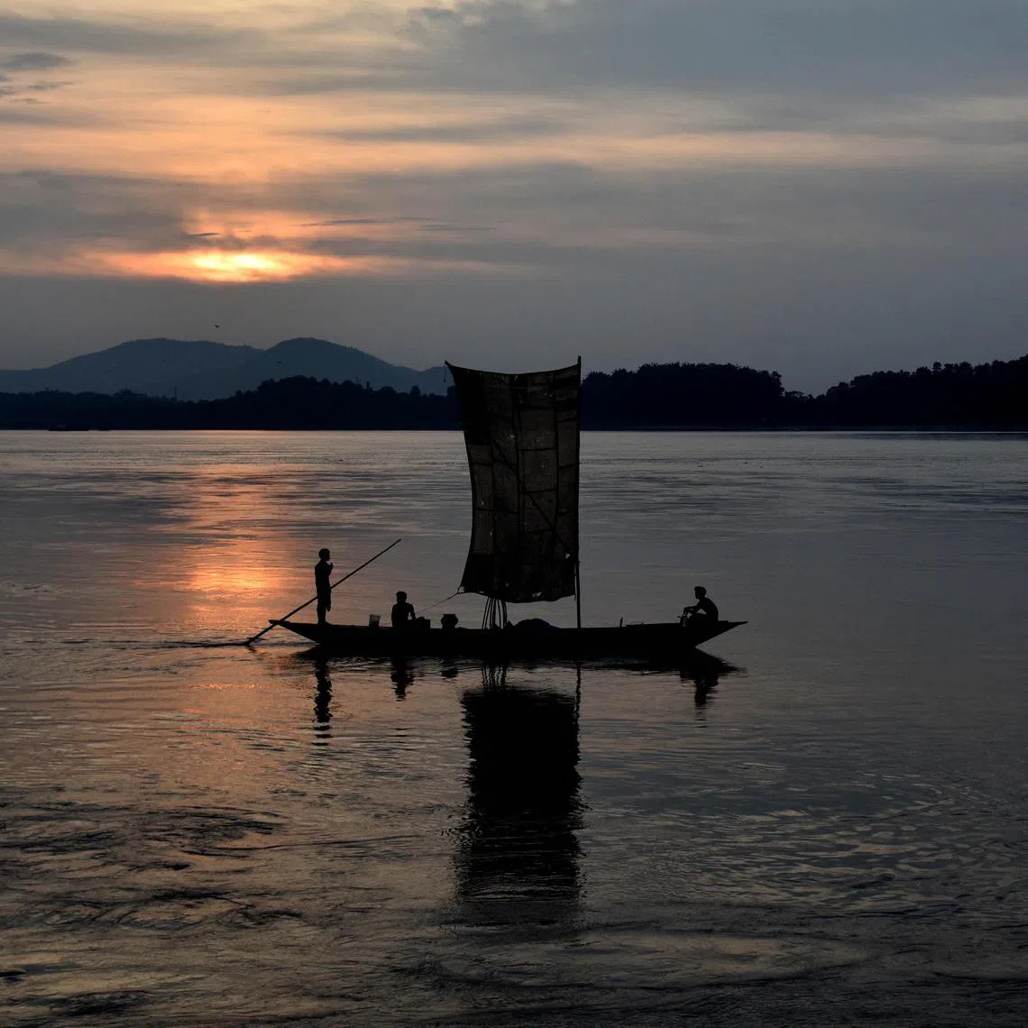 ddarunachaldam// Indian fishermen paddle their down the Brahmaputra River during sunset in Guwahati on August 6, 2015. The Brahmaputra originates in Tibet, where it is known as the Yarlung Zangbo it enters India as the Siang and then onto the Bay of Bangal through Bangladesh as the Jamuna. Fishing provides a livelihood for hundreds of thousands who live along the banks of the river.