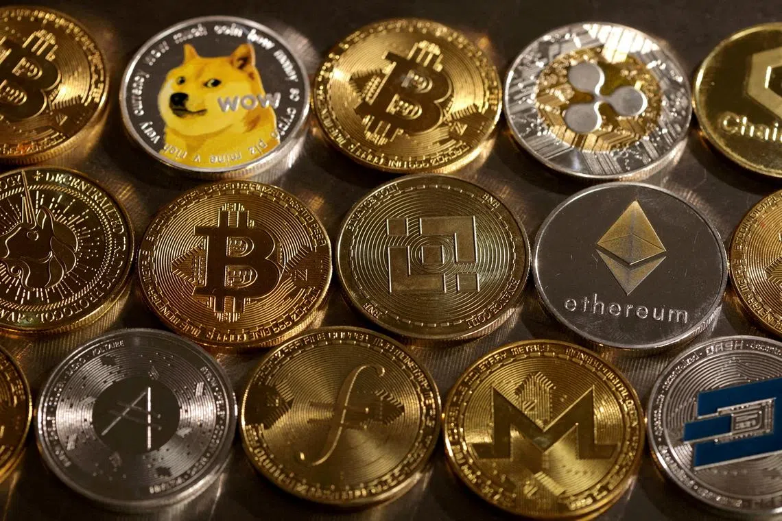 FILE PHOTO: FILE PHOTO: Representations of cryptocurrencies are seen in this illustration, August 10, 2022. REUTERS/Dado Ruvic/Illustration/File Photo/File Photo