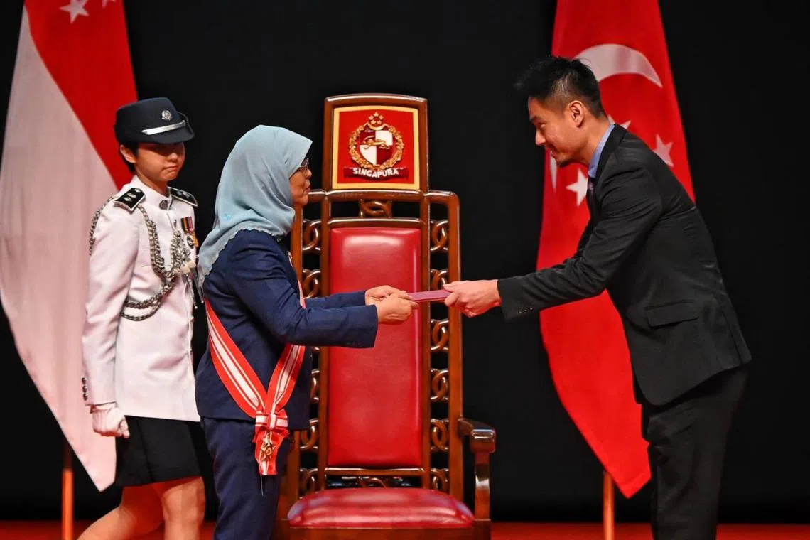 ST chief photojournalist Kevin Lim received the President’s Certificate of Commendation (Covid-19) on behalf of SPH Media Trust from President Halimah Yacob.