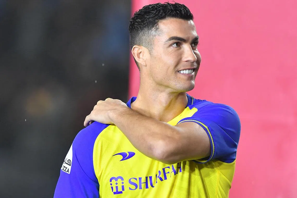 Al-Nassr's new forward Cristiano Ronaldo takes the stage during his unveiling in the Saudi Arabian capital, Riyadh, on Jan 3, 2023. 