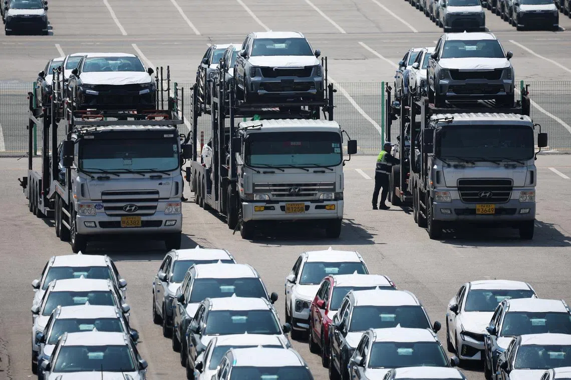 FILE PHOTO: Car carriers transporting vehicles made by Kia Motors, which is part of South Korea's biggest automaker company Hyundai Motor, are parked at Pyeongtaek port in Pyeongtaek, South Korea, April 15, 2025. REUTERS/Kim Hong-Ji/File Photo