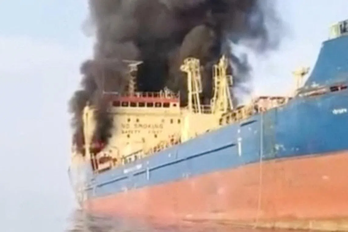 Smoke billows from an oil tanker under U.S. sanctions, that was hit off Oman's Musandam peninsula, in this screen grab from a video obtained by REUTERS on March 1, 2026.
