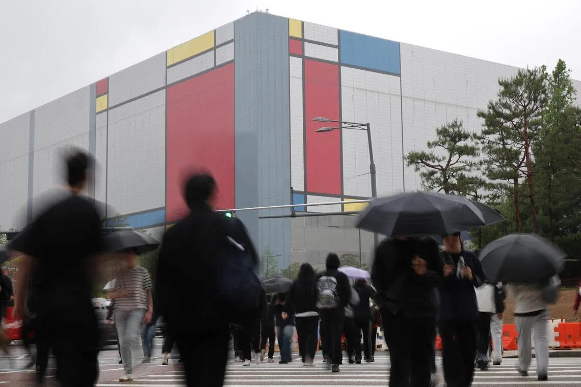 Employees head to work at Samsung Electronics semiconductor plant in Pyeongtaek, South Korea, on May 21.