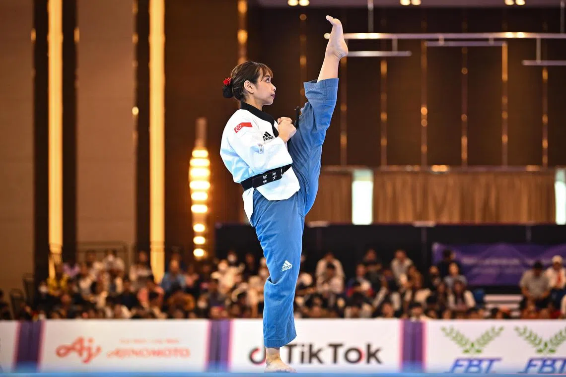 Diyanah Aqidah Dian Khudhairi performing in the taekwondo women's poomsae final on May 12 . She won a silver. 