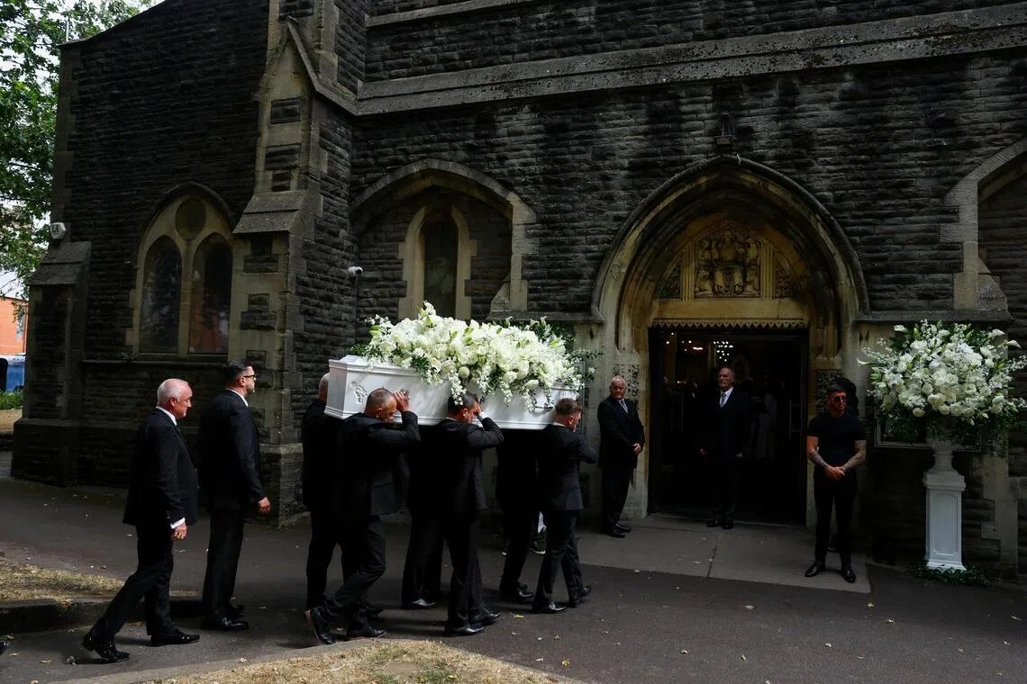 Pallbearers carry the coffin containing the remains of Gaynor Sullivan, known professionally as Bonnie Tyler, at Swansea Minster for the memorial service.