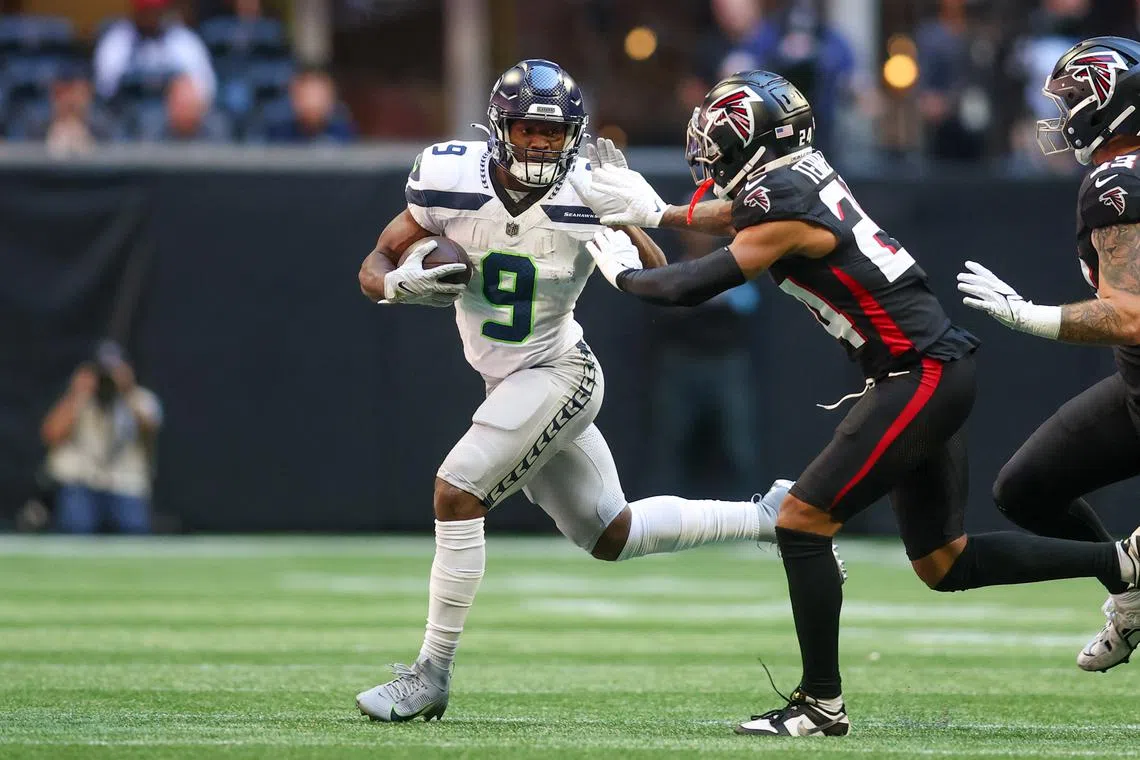 FILE PHOTO: Oct 20, 2024; Atlanta, Georgia, USA; Seattle Seahawks running back Kenneth Walker III (9) is pushed out of bounds by Atlanta Falcons cornerback A.J. Mandatory Credit: Brett Davis-Imagn Images/File Photo