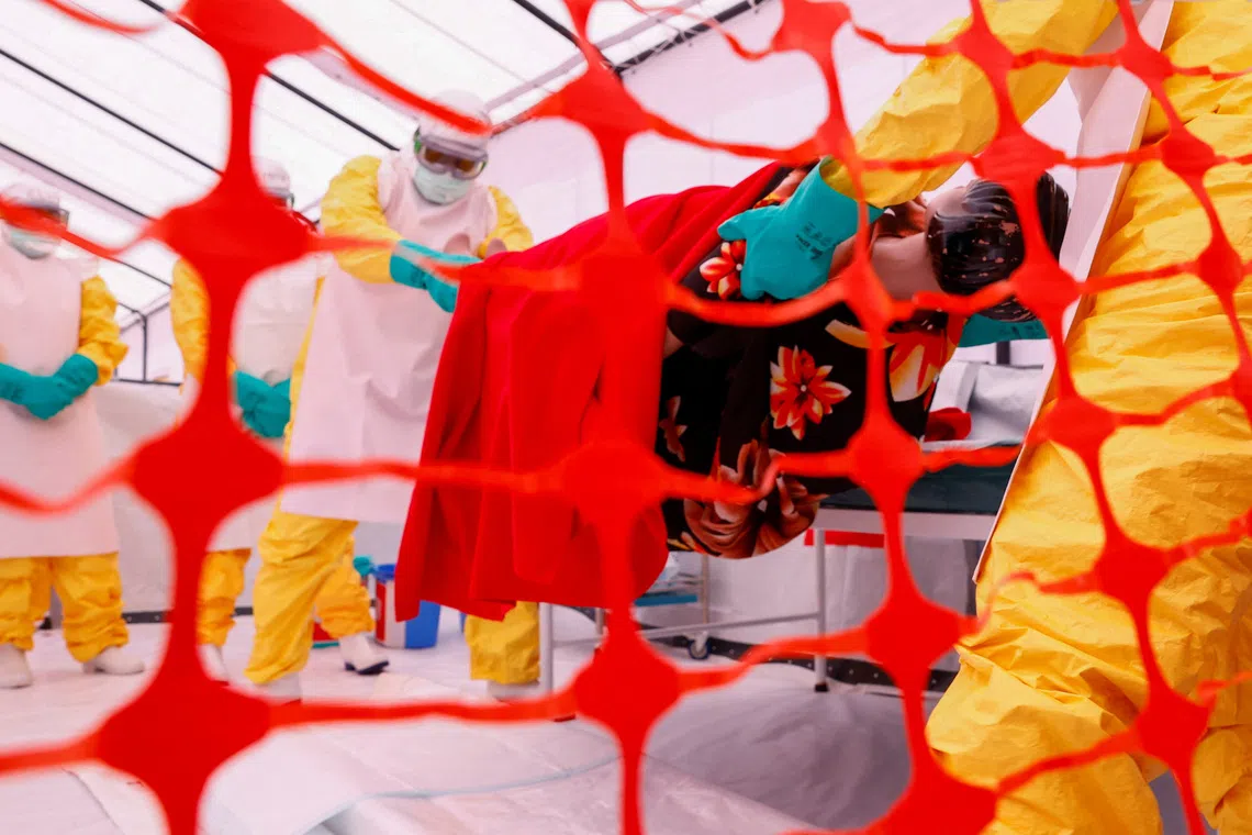 Health workers attend a training for personnel preparing to reinforce regional Ebola response capacity in the Democratic Republic of Congo.