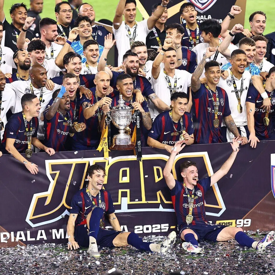 Johor Darul Takzim celebrate after defeating Kuching City 2-0 at the Bukit Jalil National Stadium to win the Malaysia Cup on May 23.