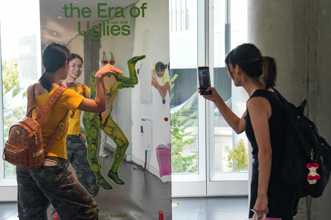 Visitors at the Era Of Uglies Has Arrived exhibition in Hangzhou, China, on Aug 13. 