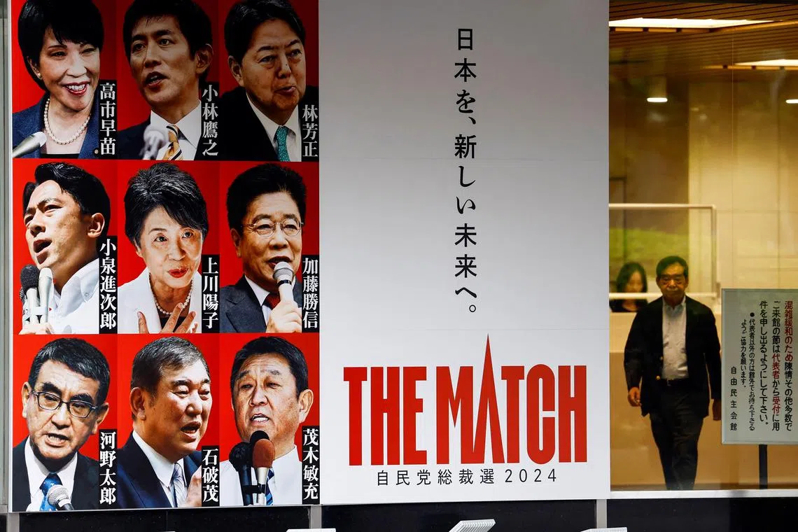 A poster showing the portraits of candidates in the running for Japan's ruling Liberal Democratic Party (LDP) election at party headquarters in Tokyo