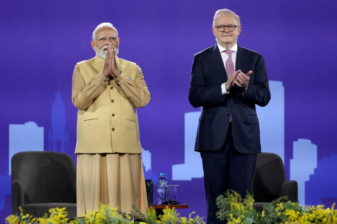 Australian PM Anthony Albanese (right) and Indian PM Narendra Modi on stage during a community event at Docklands Stadium in Melbourne, on July 9.