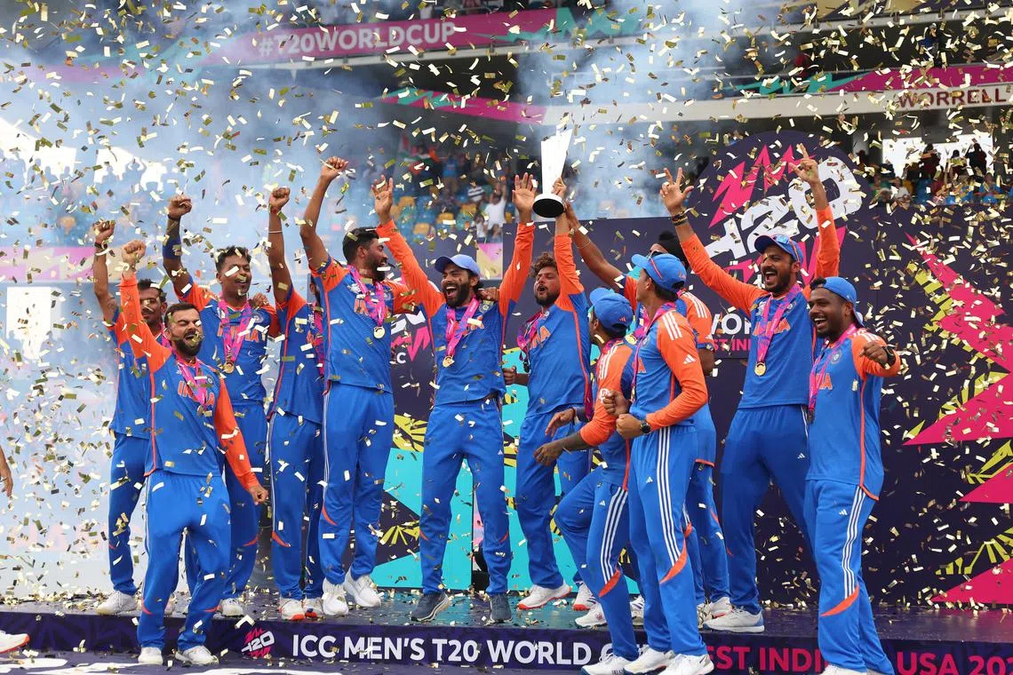 FILE PHOTO: Cricket - ICC T20 World Cup 2024 - Final - India v South Africa - Kensington Oval, Bridgetown, Barbados - June 29, 2024 India's Kuldeep Yadav lifts the trophy as they celebrate after winning the T20 World Cup REUTERS/Ash Allen/File Photo