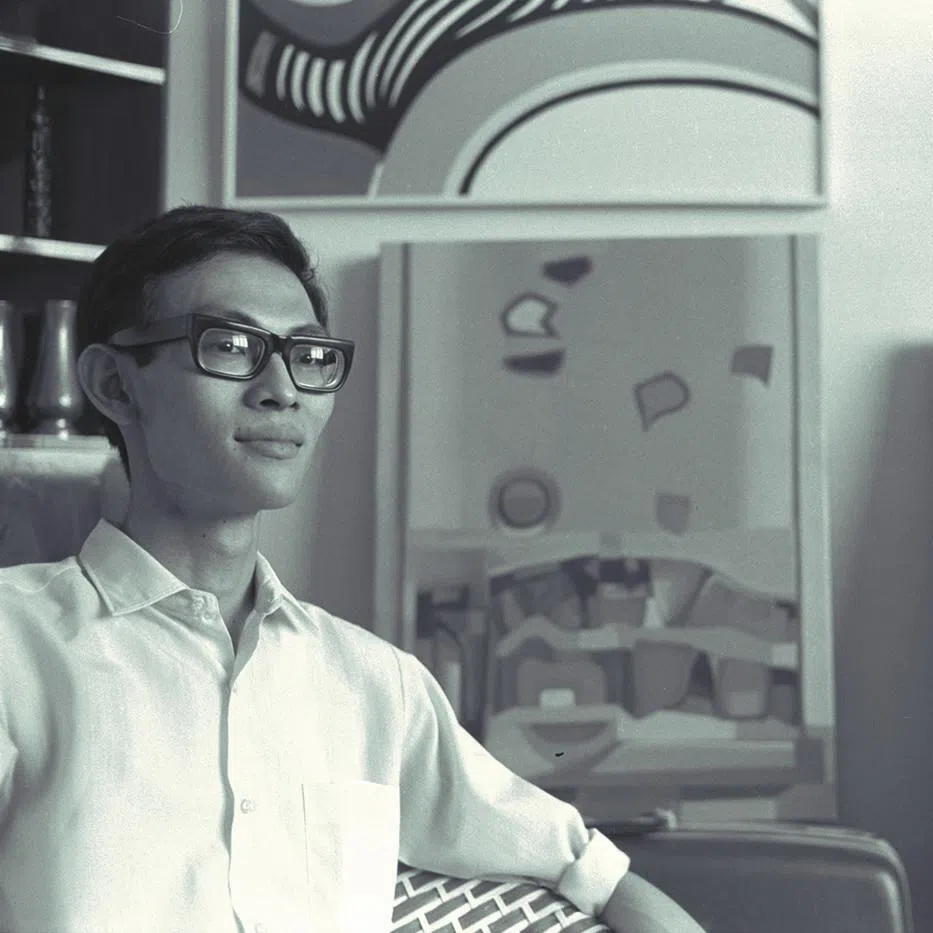An old photograph of poet and painter Arthur Yap with his paintings at Tanglin Road.