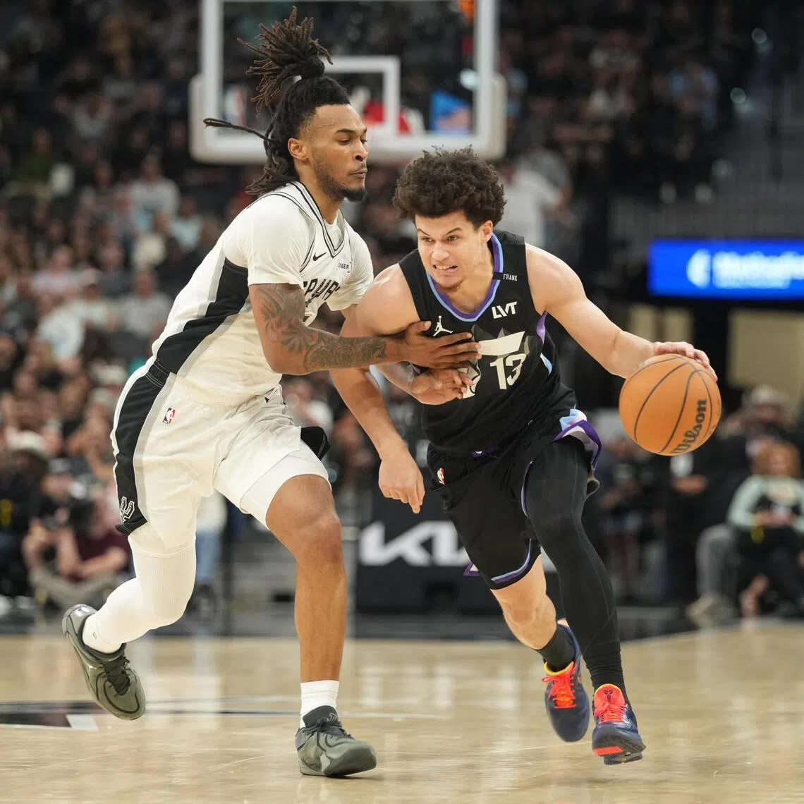 Utah Jazz guard Walter Clayton drives to the basket against San Antonio Spurs guard Stephon Castle during the first half at Frost Bank Center. 