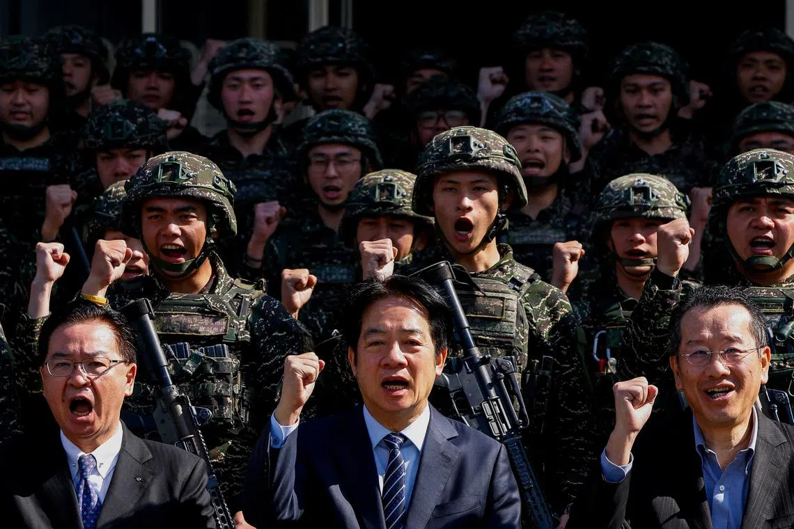 FILE PHOTO: Taiwan's President Lai Ching-te poses for a group photo at Songshan airbase in Taipei, Taiwan March 21, 2025. REUTERS/Ann Wang/File Photo