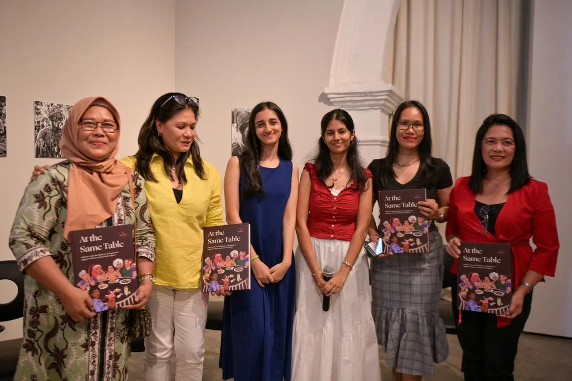 At The Same Table project leaders Tanya Arora (third from left) and Aahana Mittal (fourth from left) with some of the cooks featured in the cookbook.