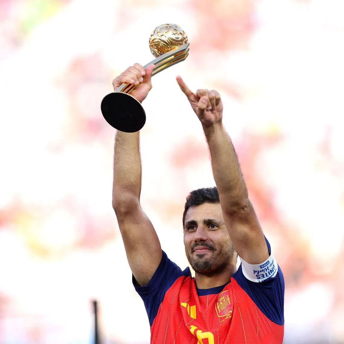 Spain’s Rodri celebrating on the podium after winning the Golden Ball following the FIFA World Cup 2026 final.