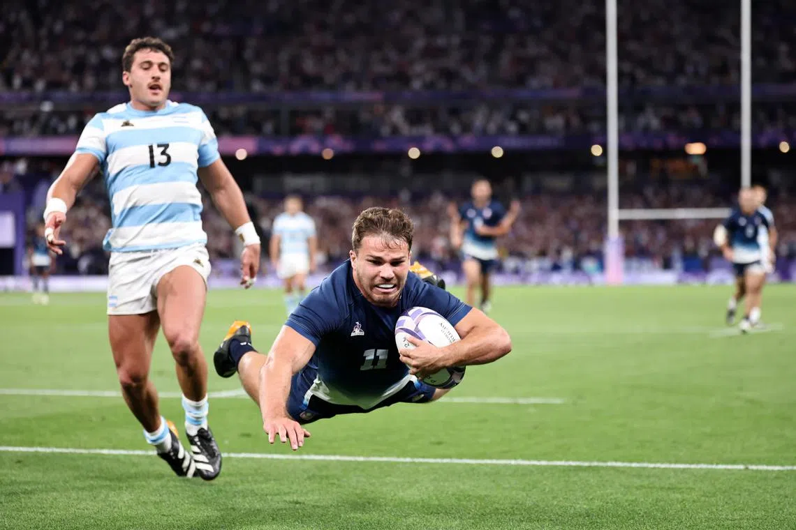 Antoine Dupont of France scores a try during the Olympics rugby sevens quarter-final clash against Argentina. The home side won 26-14 and will face South Africa next.