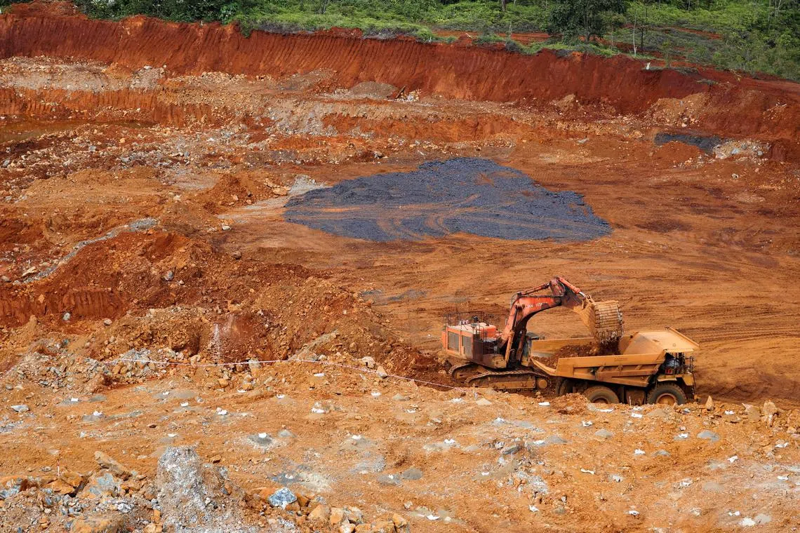 An excavator loads raw nickel ore into a dump truck at a nickel mining site of Vale in Sorowako, South Sulawesi province, Indonesia, March 29, 2023. REUTERS/Ajeng Dinar Ulfiana