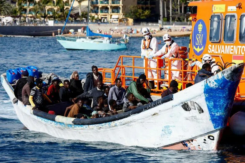 A Spanish Coast Guard vessel tows a fibreglass boat with migrants onboard to the port of Arguineguin, on the island of Gran Canaria, Spain, on March 5, 2025.