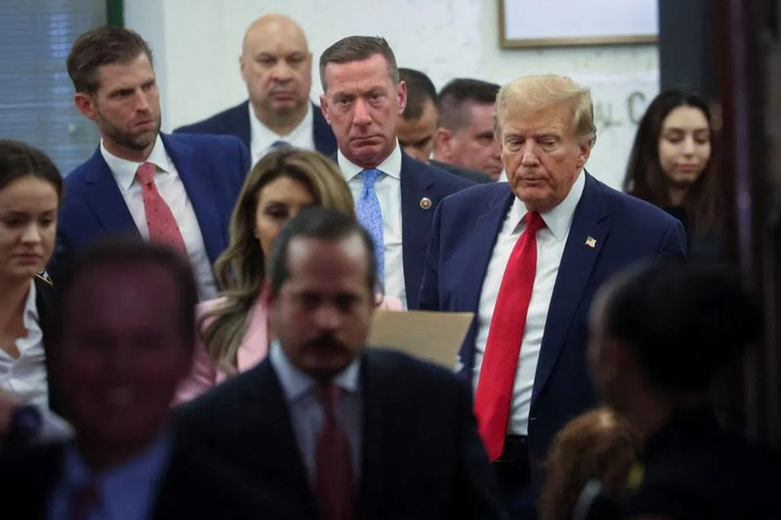 Former U.S. President Donald Trump leaves the courtroom during a break, as he attends the Trump Organization civil fraud trial, in New York State Supreme Court in the Manhattan borough of New York City, U.S., December 7, 2023. REUTERS/Mike Segar