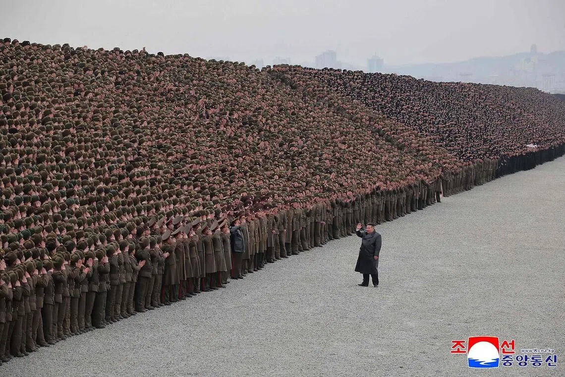 North Korean leader Kim Jong Un participating in a commemorative photo session with soldiers who were involved in the construction of the Sinuiju Combined Greenhouse Farm in North Pyongan Province, North Korea, on Feb 1, 2026.