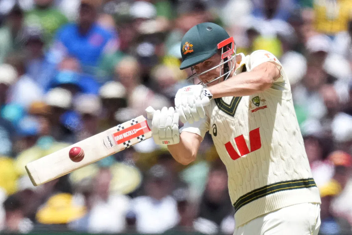 FILE PHOTO: Cricket - The Ashes - Australia v England - Fourth Test -  MCG, Melbourne, Australia - December 26, 2025 Australia's Cameron Green batting plays a shot for four runs against bowler England's Josh Tongue.    REUTERS/Asanka Brendon Ratnayake/File Photo