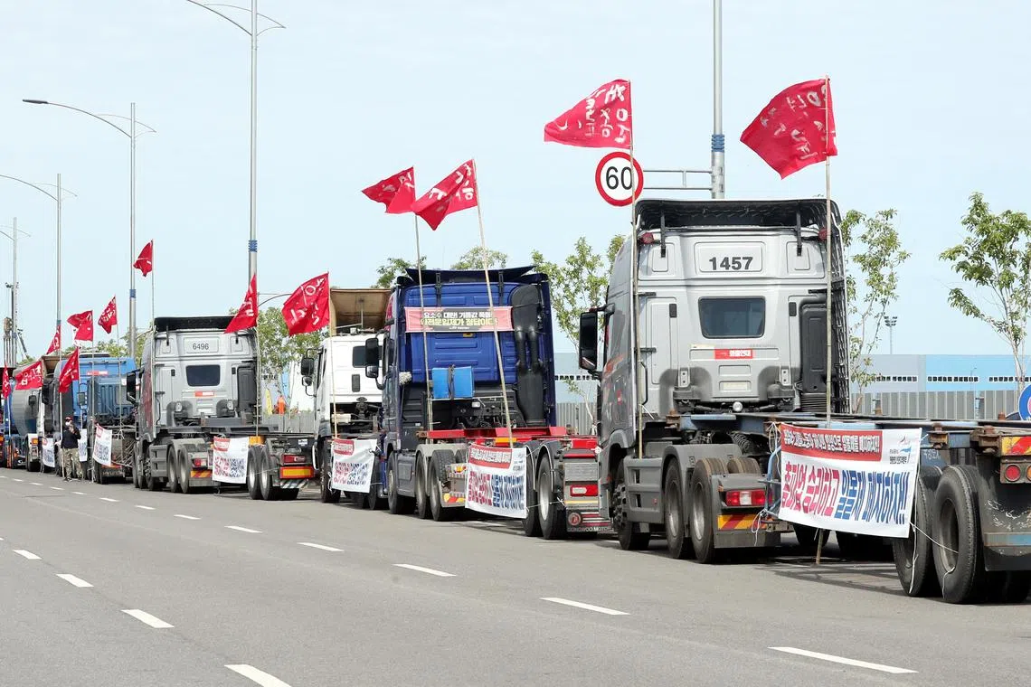 Cargo trucks occupy a road at a port in Incheon, South Korea, during a strike earlier this year.  PHOTO: EPA-EFE 