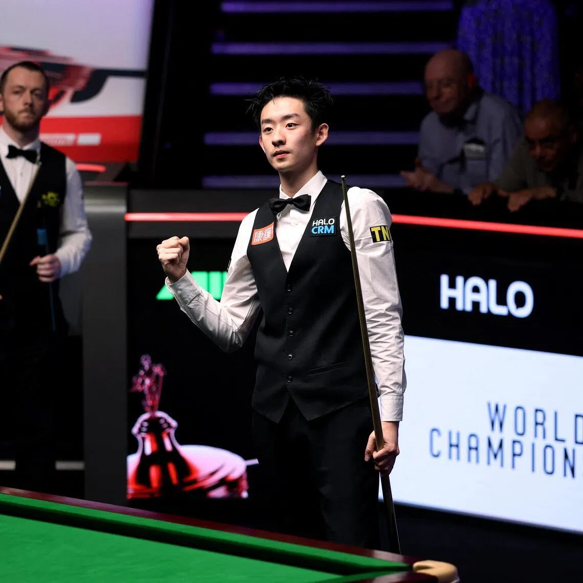 China's Wu Yize celebrates winning his World Snooker Championship semi-final against Northern Ireland's Mark Allen 17-16 at The Crucible Theatre in Sheffield on May 2, 2026.