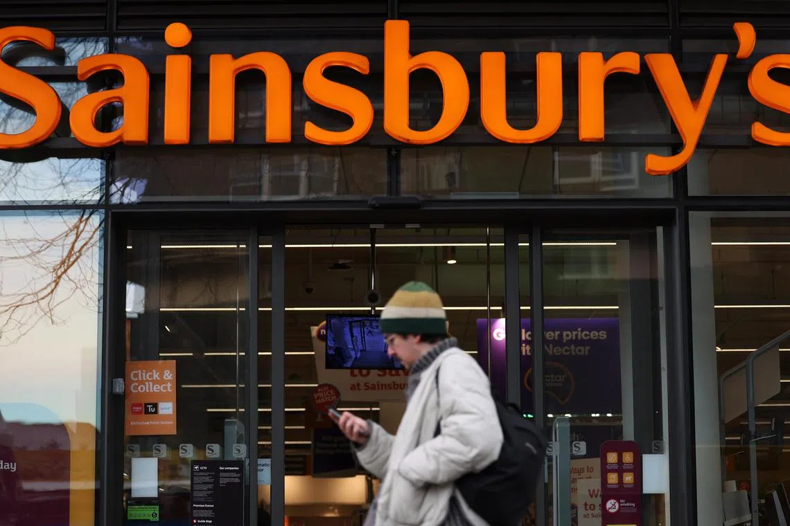 epa11816616 A pedestrian passes a Sainsbury’s supermarket in London, Britain, 10 January 2025. Sainsbury’s, the UK’s second-largest supermarket group, is set to announce a full-year profit growth of around 7 percent following bumper Christmas sales.  EPA-EFE/ANDY RAIN